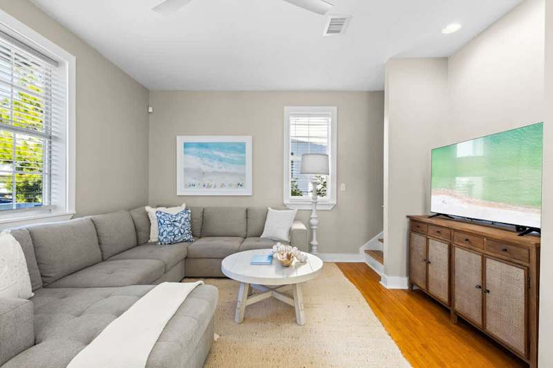 Living area features a smart tv, playing cards and board games.