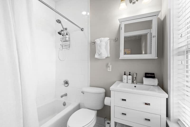 Bathroom features a shower/tub combo.