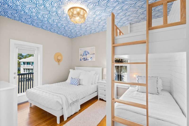 Guest bedroom features twin over twin bunks and a queen bed.