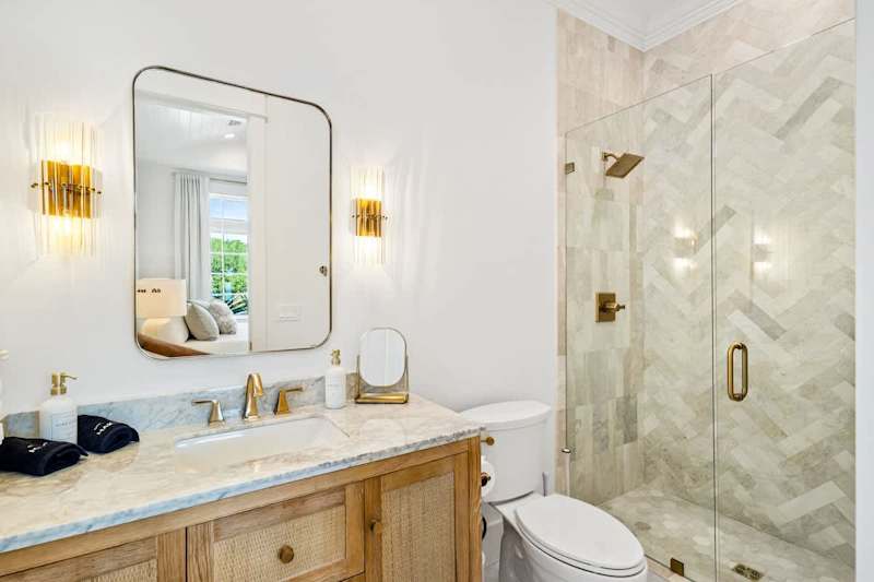 Bathroom features a large walk-in shower.
