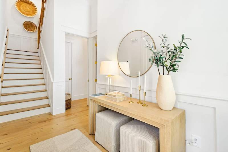 First floor entry boosts tons of natural light and a vaulted ceiling.