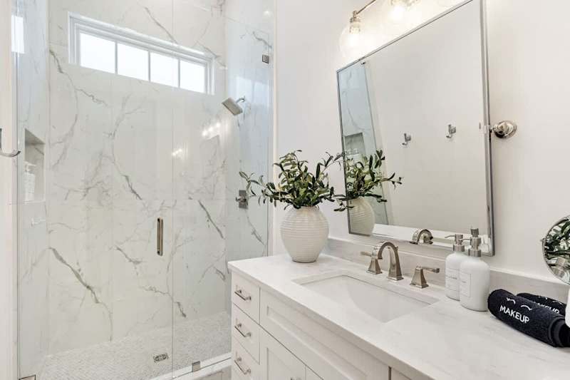 Bathroom features a large walk-in shower.