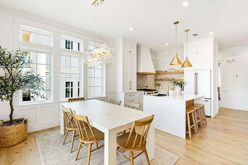 Dining room table features seating for 6 with an additional 3 seats at the kitchen island.
