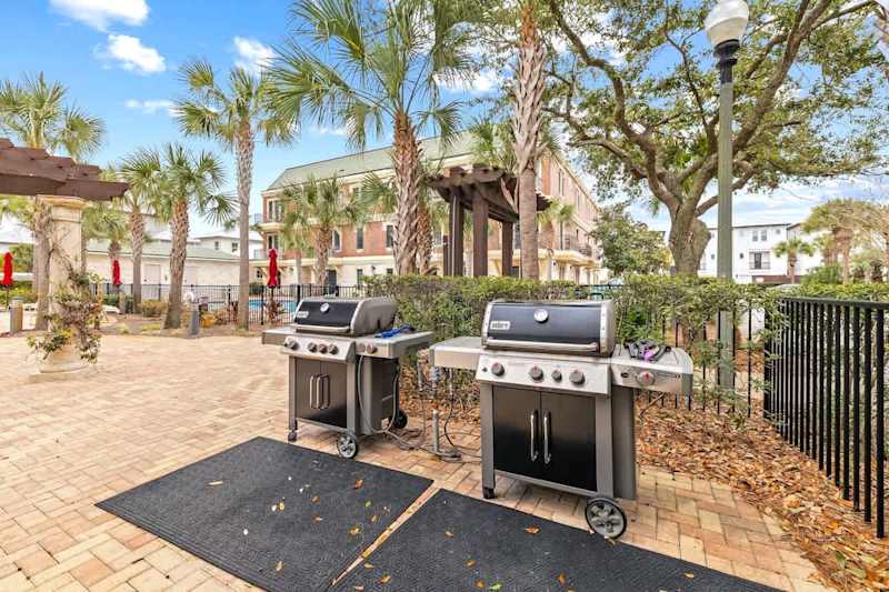 Gas grills by community pool.