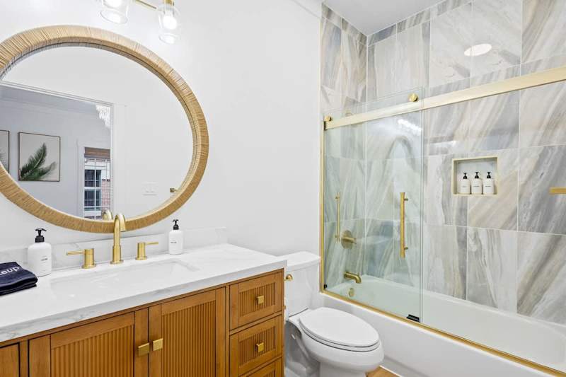 Bathroom with luxurious finishes. Features a walk-in shower.