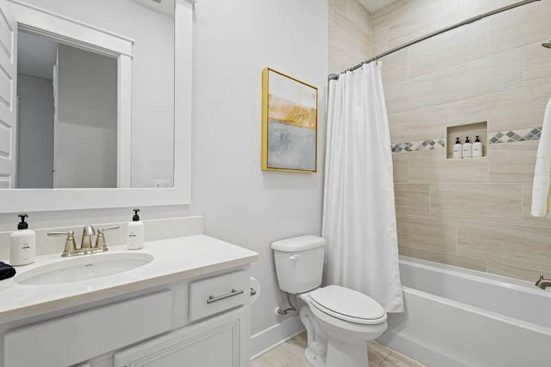 Second floor bathroom features a shower/tub combo.