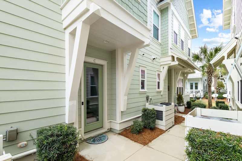 Entrance to the home is to the right of the garage.