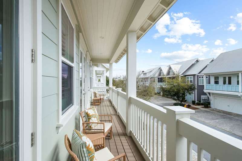 Large balcony spans across the front of the home- perfect for catching sunrise or sunset!