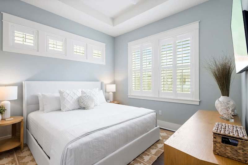 Primary bedroom features a king bed, smart tv and ensuite.
