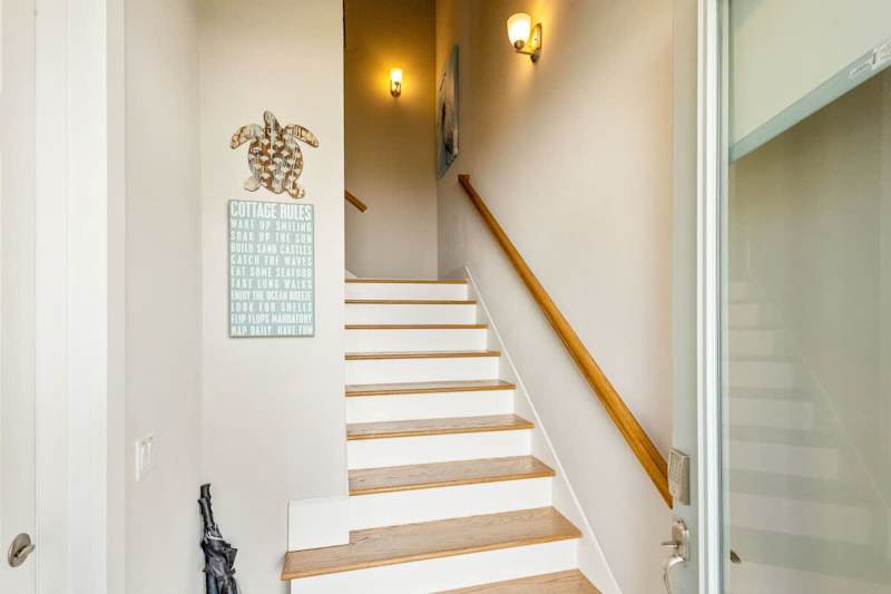 Entrance to home is to the right of the driveway.