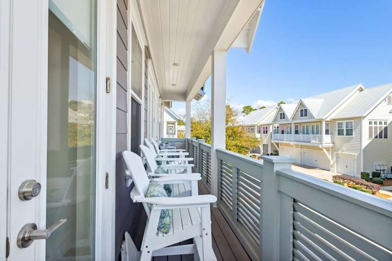 Large balcony spans across the front of the home- perfect for catching sunrise or sunset!