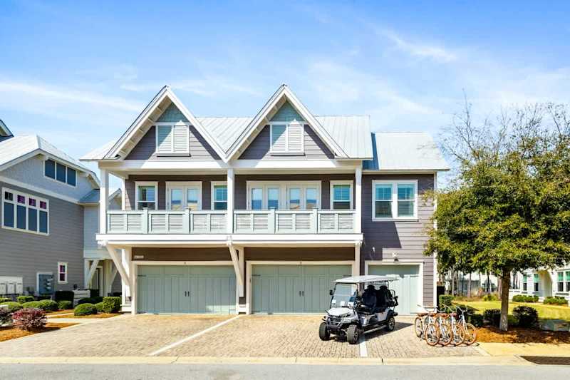 Home includes one driveway parking space in front of the single car garage door.
