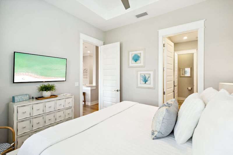 Primary bedroom features a king bed, smart tv and ensuite.