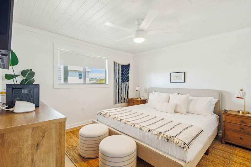 Primary bedroom features a king bed, smart tv and ensuite.