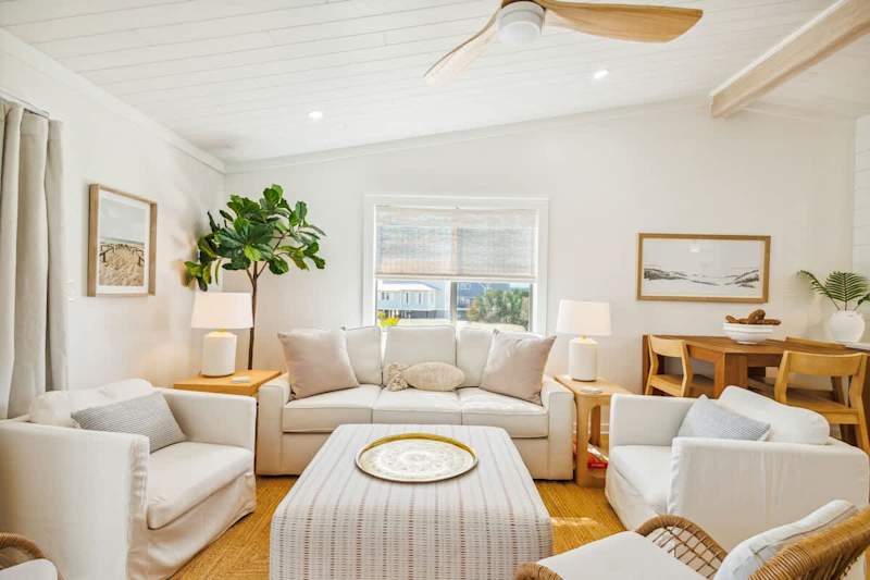 Living room features a queen sleeper sofa.