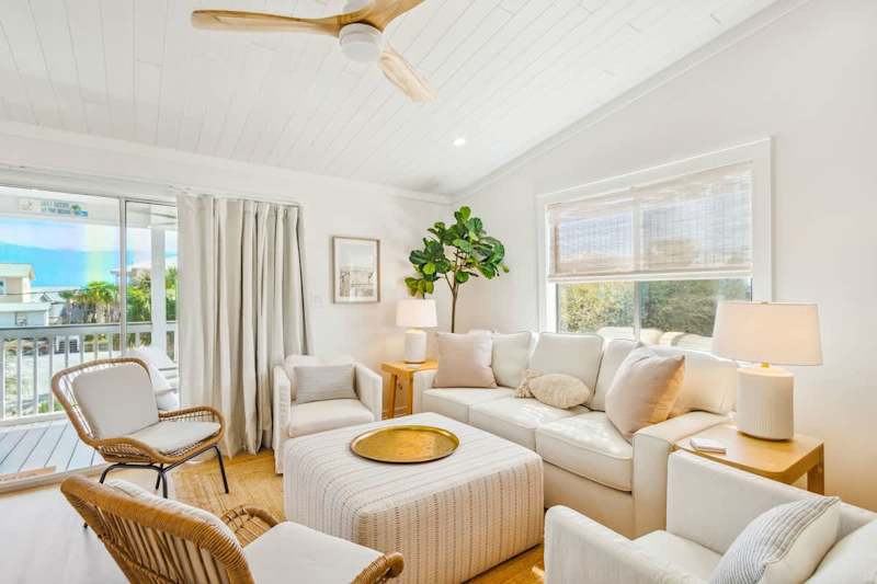 Living room features plenty of seating for all.