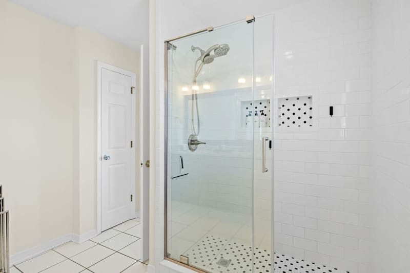 Bedroom #3 features an ensuite with dual vanities and a walk-in shower.