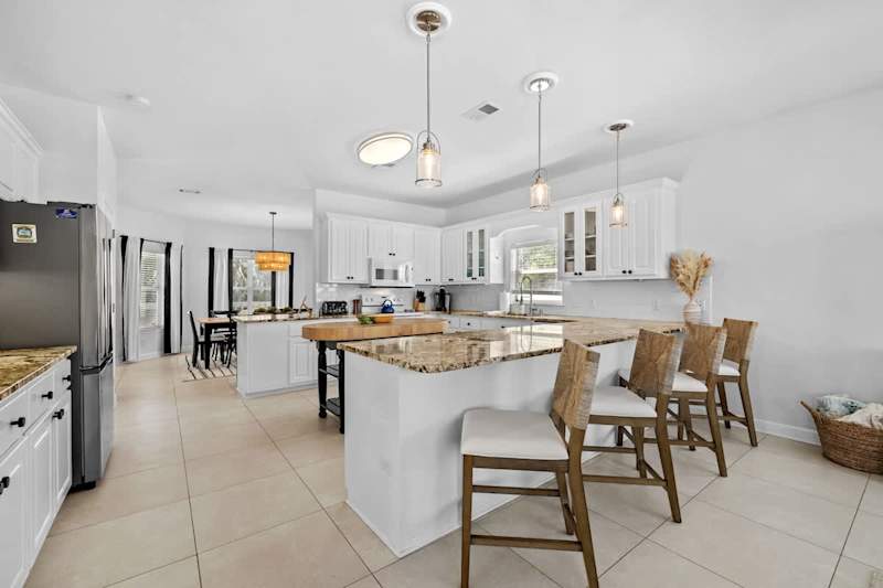 Large kitchen is fully stocked with all your cooking essentials! Perfect for cooking together.