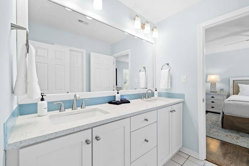 Bedroom #1 and #2 features Jack-n-Jill bathroom that includes dual vanities and a shower/tub combo.