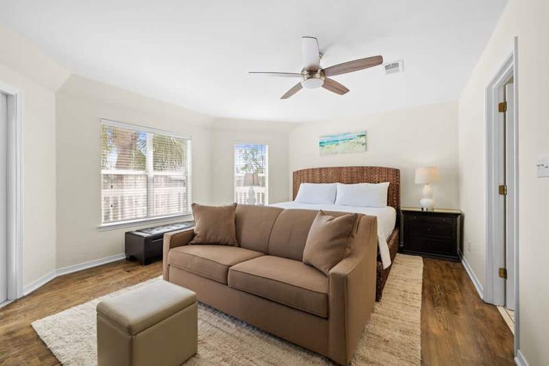 Bedroom #3 features a king bed and full sleeper sofa with a smart tv.