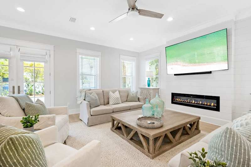 Living room features an 85" TV with Sonos sound system and subwoofer. Perfect for movie night!
