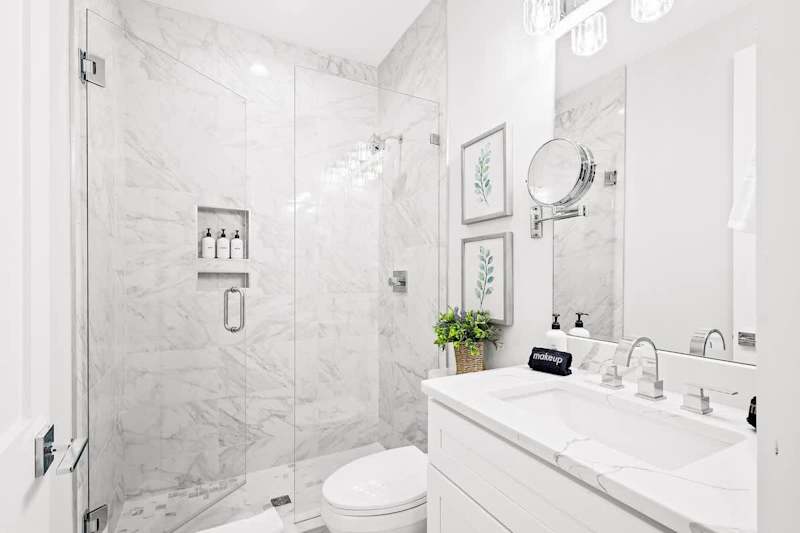 Ensuite bath featuring walk in shower,