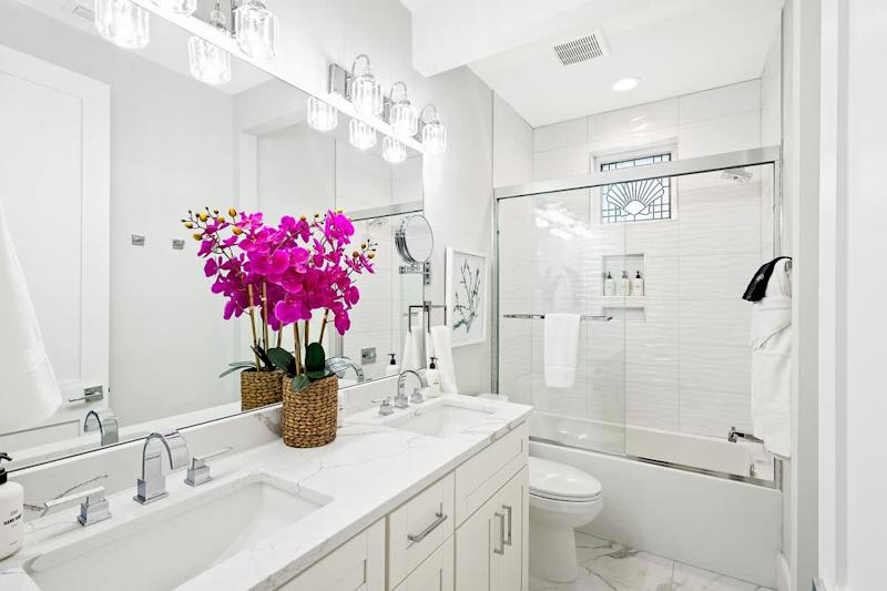 Second floor full bath features a shower/tub combo.