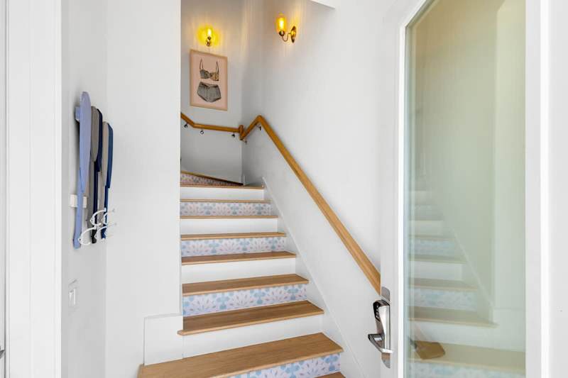 Entrance to home is to the right of the driveway.