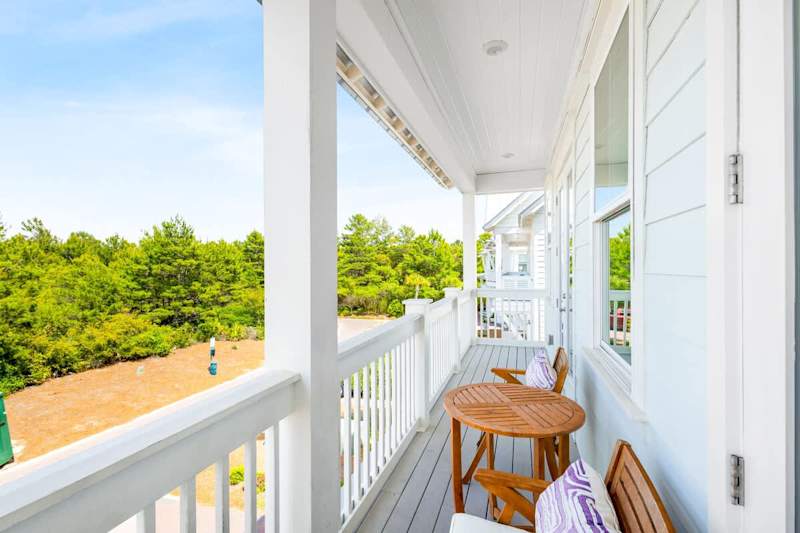Large balcony spans across the front of the home- perfect for catching sunrise or sunset!