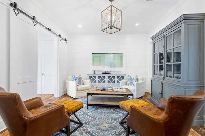 First floor living space features seating and a smart tv. Perfect for unwinding before bed.