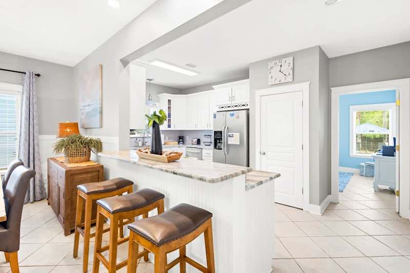 Kitchen island includes additional seating for 3.