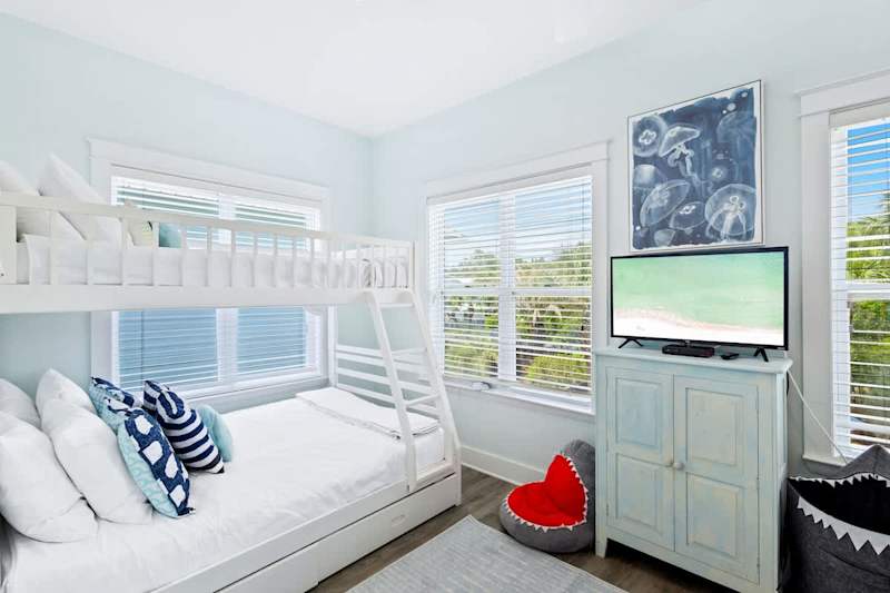 Bedroom #3 features (2) twin over full bunks and a smart tv.
