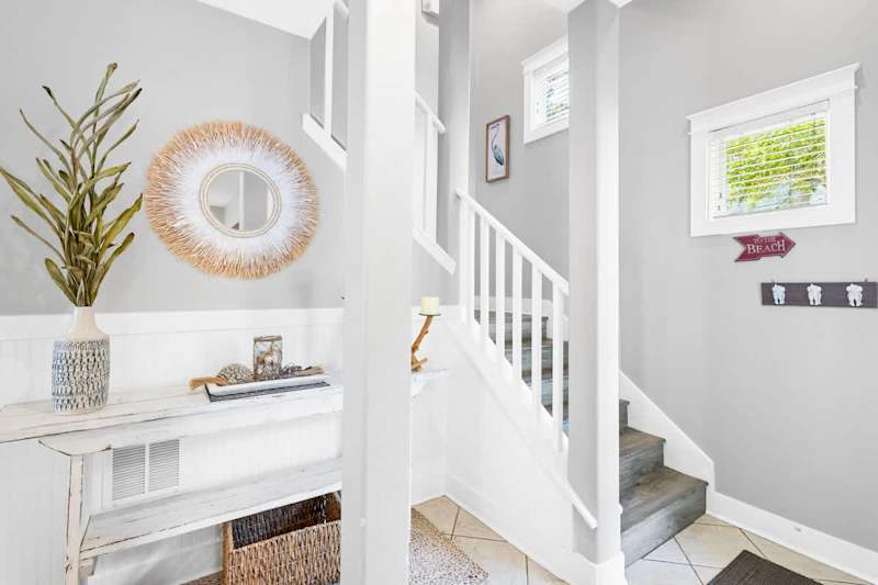 Stairs lead to the second floor featuring two additional bedrooms.
