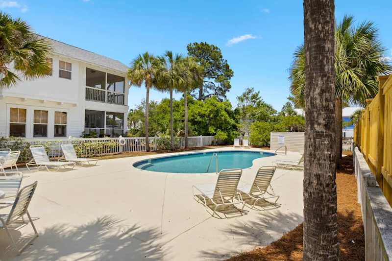 Community pool includes sun loungers to soak in the rays of 30a.