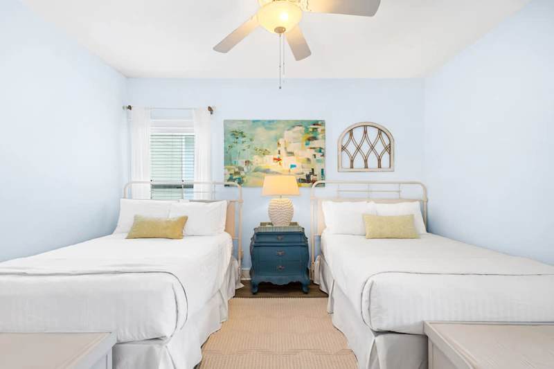 Bedroom #2 features (2) full beds, smart tv and an ensuite.