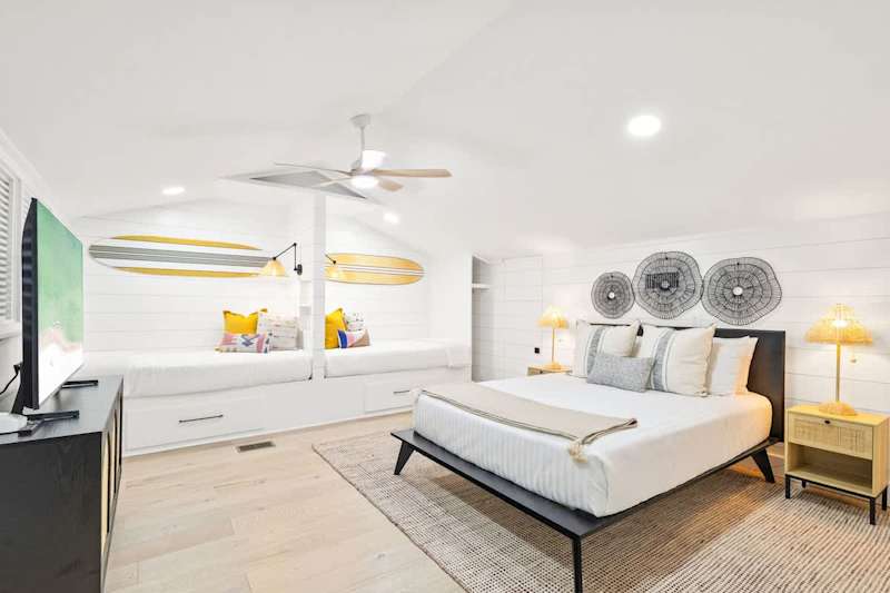 Bedroom #3 features a queen bed, (2) built in twin beds and an ensuite.