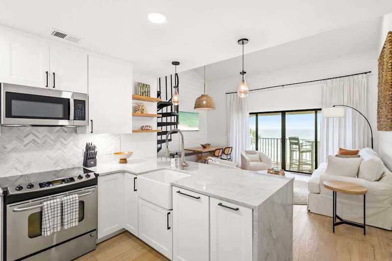 Kitchen island includes seating for three.