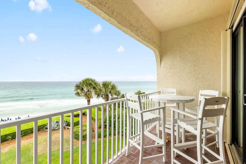 Beautiful covered balcony is the perfect place to enjoy morning coffee with a view.