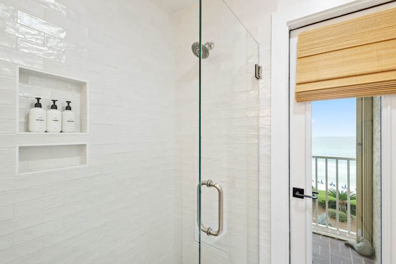 Bathroom includes access to balcony.