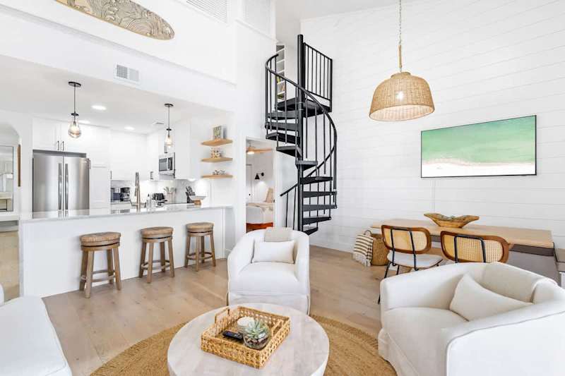 Living room includes ample seating and a smart tv. Perfect for winding down in the evenings.
