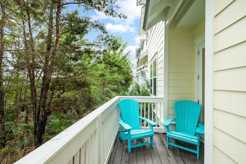 Large patio off living room features two seating areas.