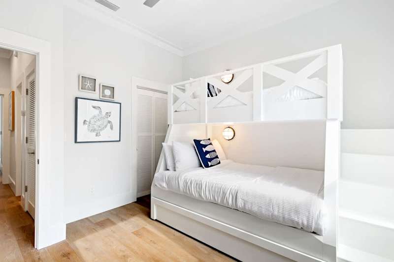 Bedroom #1 features a twin/queen bunk with a twin trundle and a smart tv.