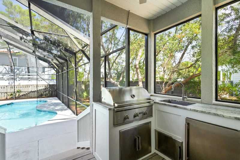 Back patio features a gas grill. Perfect for pool side cookouts!