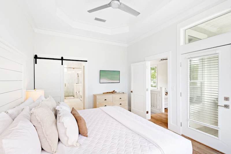 Bedroom features a smart tv, ensuite and walkout to balcony.