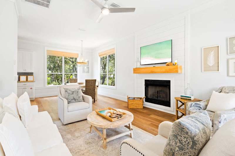 Home features a reverse floor plan, with living, dining, and kitchen on the second floor.