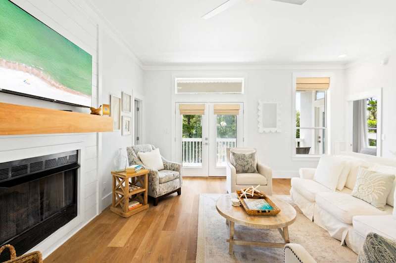 Home features a reverse floor plan, with living, dining, and kitchen on the second floor.