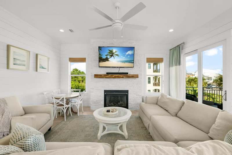 Living area offers plenty of seating and a 75" smart TV!