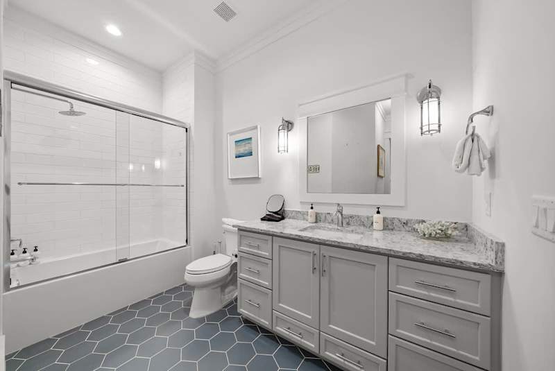 First floor bathroom features shower/tub combo.