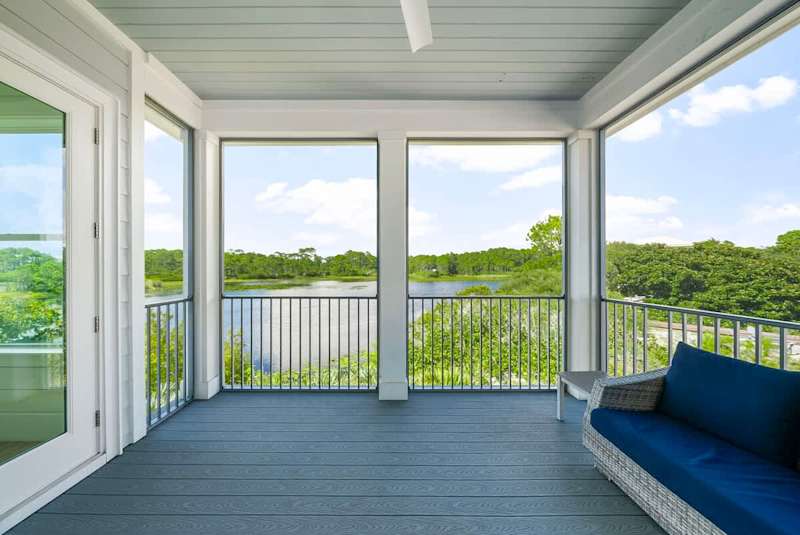 The 2nd floor offers a large private screened in porch w/ seating & a swing, perfect for morning coffee & taking in the lake views.