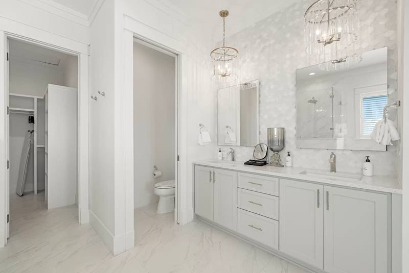Bathroom features dual vanities.